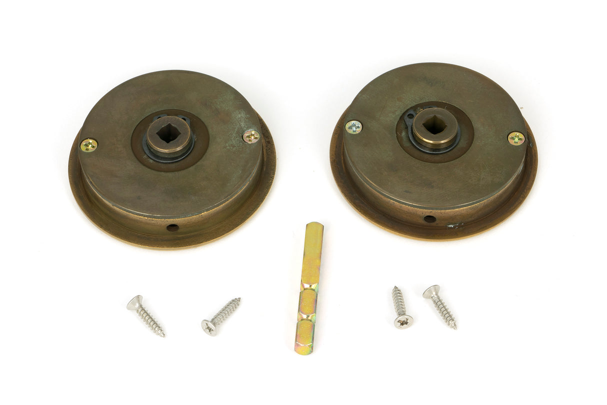 From The Anvil - Aged Brass 60mm Art Deco Round Pull - Privacy Set | Sku. 48324 | Trade Door Handles.