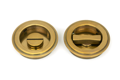 From The Anvil - Aged Brass 60mm Art Deco Round Pull - Privacy Set | Sku. 48324 | Trade Door Handles.
