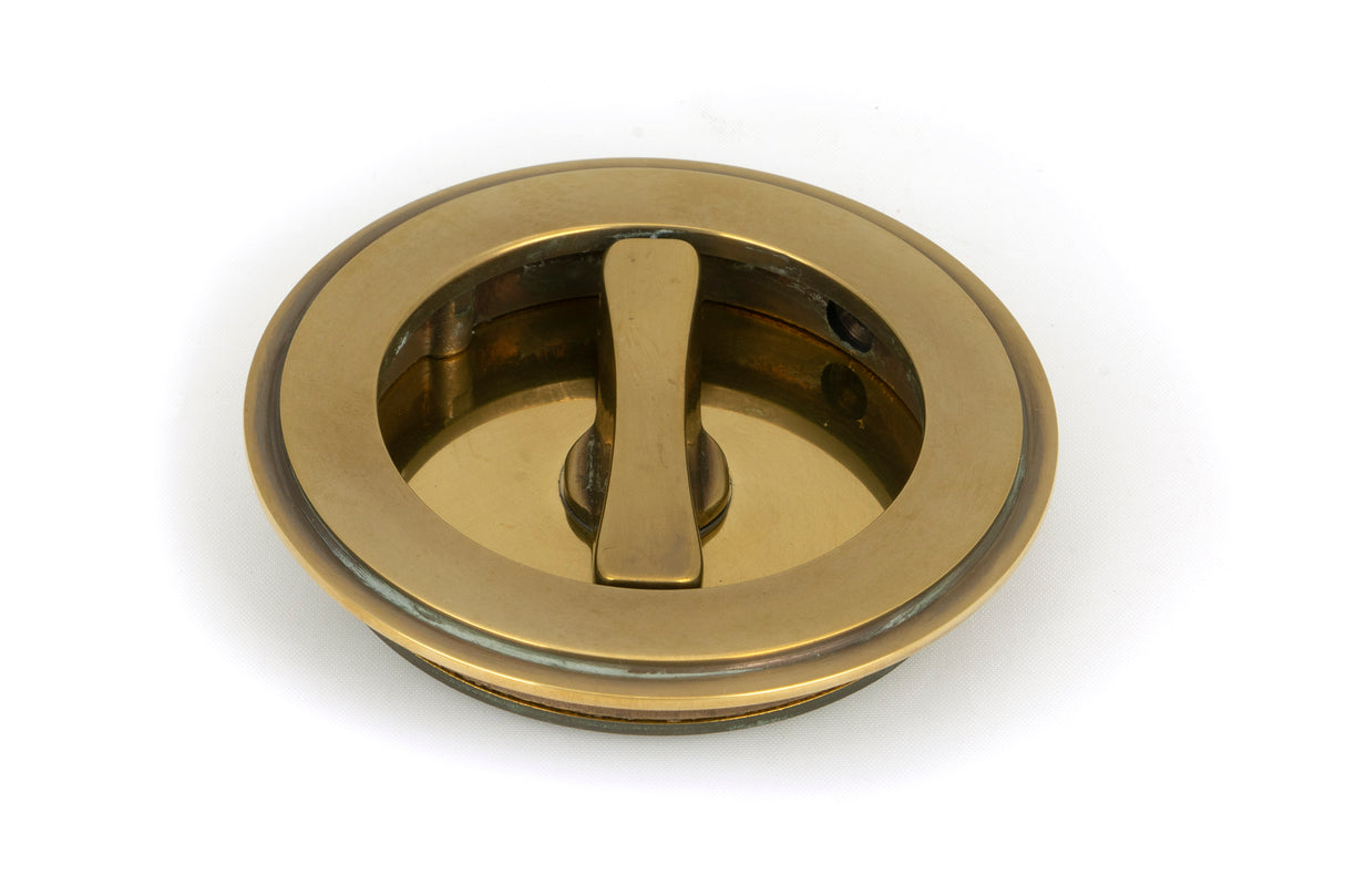 From The Anvil - Aged Brass 75mm Art Deco Round Pull - Privacy Set | Sku. 48325 | Trade Door Handles.