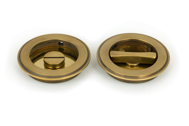 From The Anvil - Aged Brass 75mm Art Deco Round Pull - Privacy Set | Sku. 48325 | Trade Door Handles.