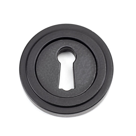 From The Anvil - Matt Black Round Escutcheon (Art Deco) | Sku. 49537 | Trade Door Handles.