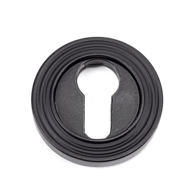 From The Anvil - Matt Black Round Euro Escutcheon (Beehive) | Sku. 49542 | Trade Door Handles.