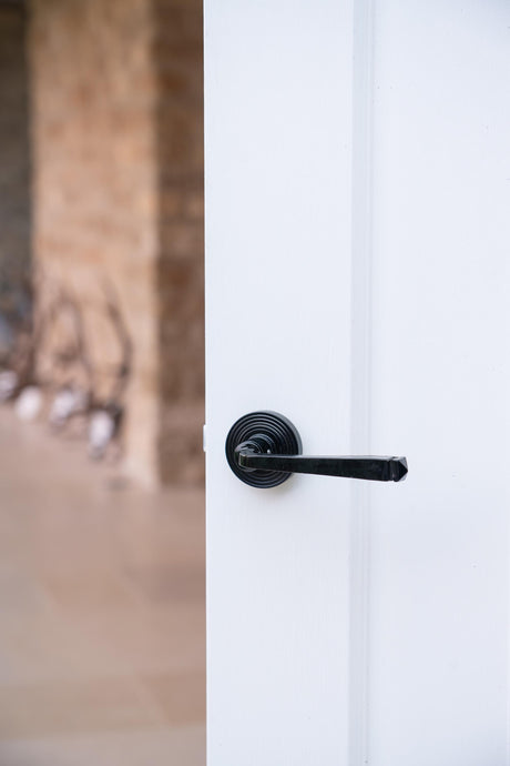 From The Anvil - Black Avon Round Lever on Rose Set (Beehive) - Unsprung | Sku. 49959 | Trade Door Handles.