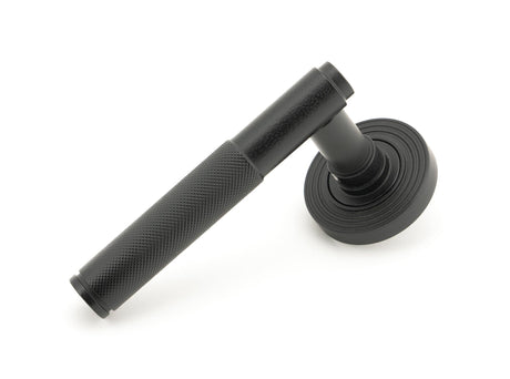 From The Anvil - Matt Black Brompton Lever on Rose Set (Beehive) - Unsprung | Sku. 50011 | Trade Door Handles.