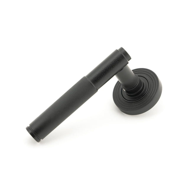 From The Anvil - Matt Black Brompton Lever on Rose Set (Beehive) - Unsprung | Sku. 50011 | Trade Door Handles.