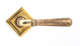 From The Anvil - Aged Brass Hammered Newbury Lever on Rose Set (Square) - Unsprung | Sku. 50040 | Trade Door Handles.