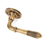 From The Anvil - Aged Brass Reeded Lever on Rose Set - Unsprung | Sku. 50086 | Trade Door Handles.