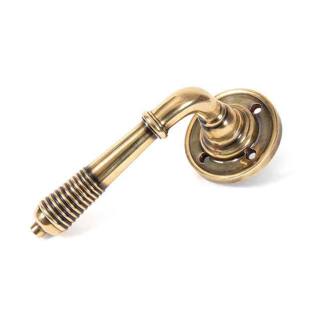 From The Anvil - Aged Brass Reeded Lever on Rose Set - Unsprung | Sku. 50086 | Trade Door Handles.