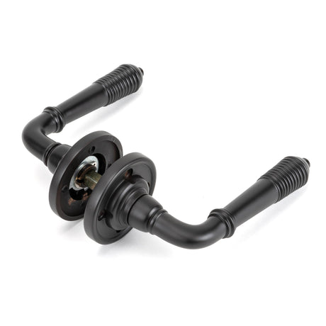 From The Anvil - Aged Bronze Reeded Lever on Rose Set - Unsprung | Sku. 50089 | Trade Door Handles.