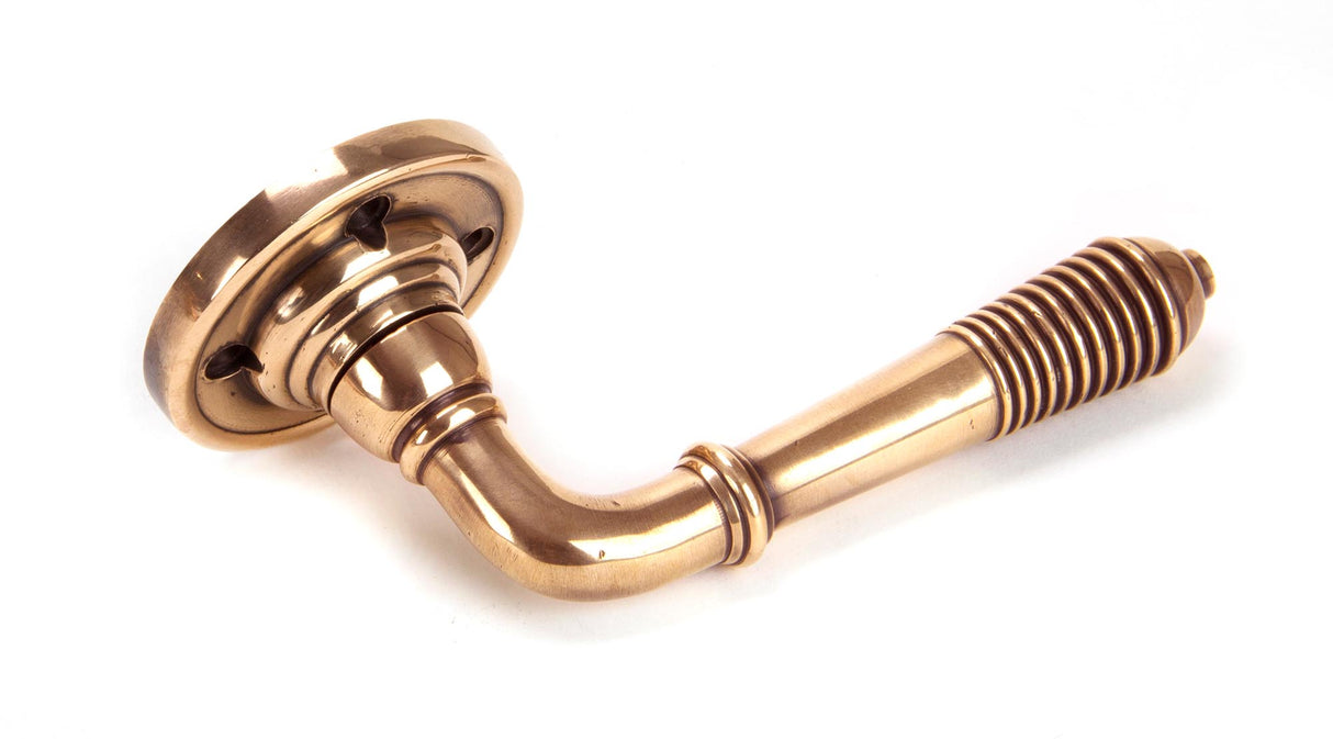 From The Anvil - Polished Bronze Reeded Lever on Rose Set - Unsprung | Sku. 50090 | Trade Door Handles.