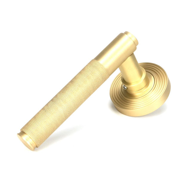 From The Anvil - Satin Brass Brompton Lever on Rose Set (Beehive) - Unsprung | Sku. 50849 | Trade Door Handles.