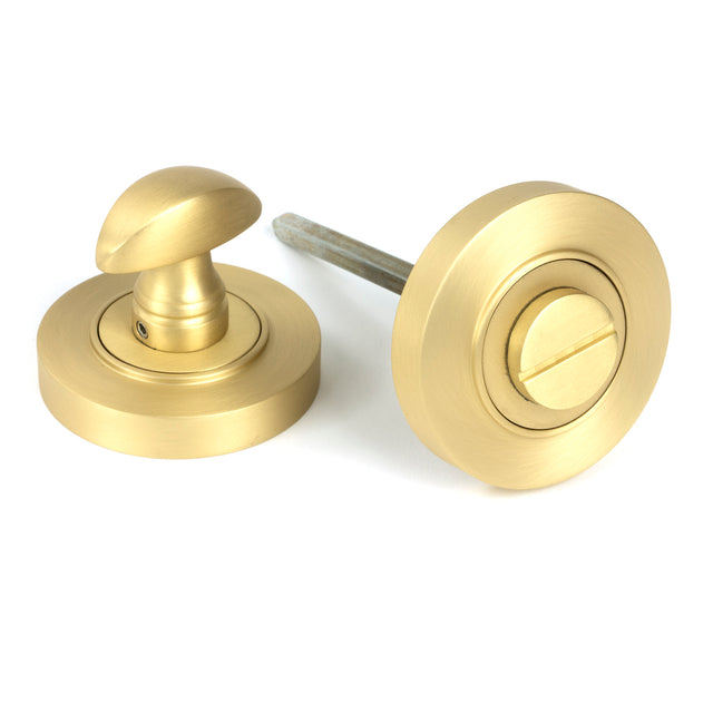 From The Anvil - Satin Brass Round Thumbturn Set (Plain) | Sku. 50880 | Trade Door Handles.