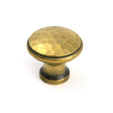 This is an image of From The Anvil - Aged Brass Hammered Cabinet Knob - Medium available to order from Trade Door Handles in Kendal.