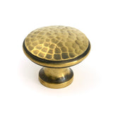 This is an image of From The Anvil - Aged Brass Hammered Cabinet Knob - Large available to order from Trade Door Handles in Kendal.