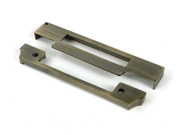 This is an image of From The Anvil - Aged Brass ½" Rebate Kit for Euro Sash Lock available to order from Trade Door Handles in Kendal.