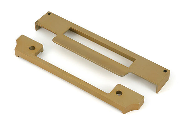 This is an image of From The Anvil - Satin Brass ½" Rebate Kit for Euro Sash Lock available to order from Trade Door Handles in Kendal.