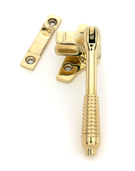 This is an image of From The Anvil - Polished Brass Night-Vent Locking Reeded Fastener (Steel Window) available to order from Trade Door Handles in Kendal.