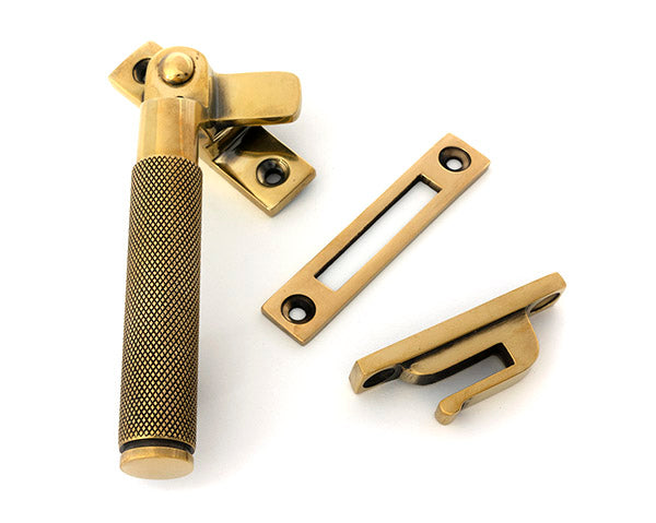 This is an image of From The Anvil - Aged Brass Locking Brompton Fastener Ã¢â‚¬â€œ LH available to order from Trade Door Handles in Kendal.