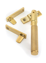 This is an image of From The Anvil - Polished Brass Night-Vent Locking Brompton Fastener available to order from Trade Door Handles in Kendal.