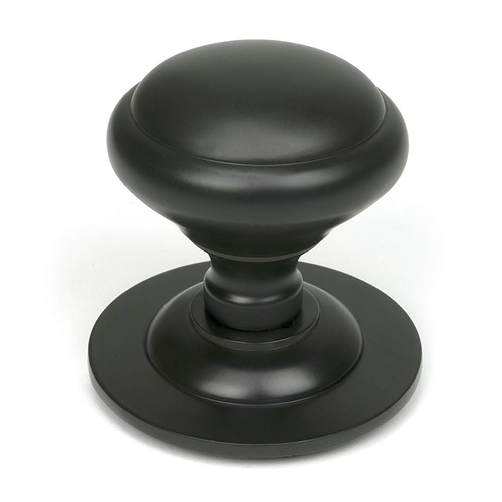 High quality images of the From The Anvil - Aged Bronze Round Centre Door Knob | Sku. Anvil-52136 | available to order from Trade Door Handles, quick delivery at discounted prices.