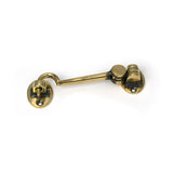 High quality images of the From The Anvil - Aged Brass 4" Cabin Hook | Sku. Anvil-52258 | available to order from Trade Door Handles, quick delivery at discounted prices.