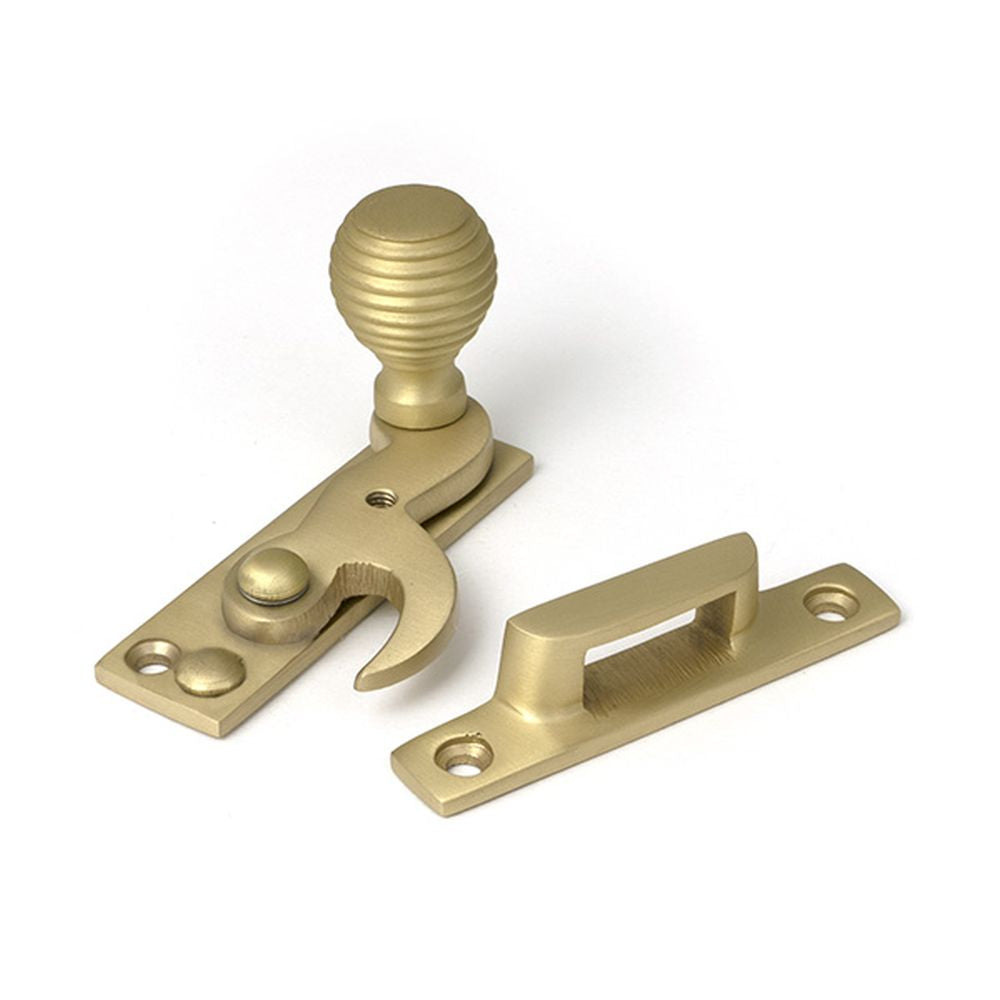 High quality images of the From The Anvil - Satin Brass Beehive Sash Hook Fastener | Sku. Anvil-52366 | available to order from Trade Door Handles, quick delivery at discounted prices.