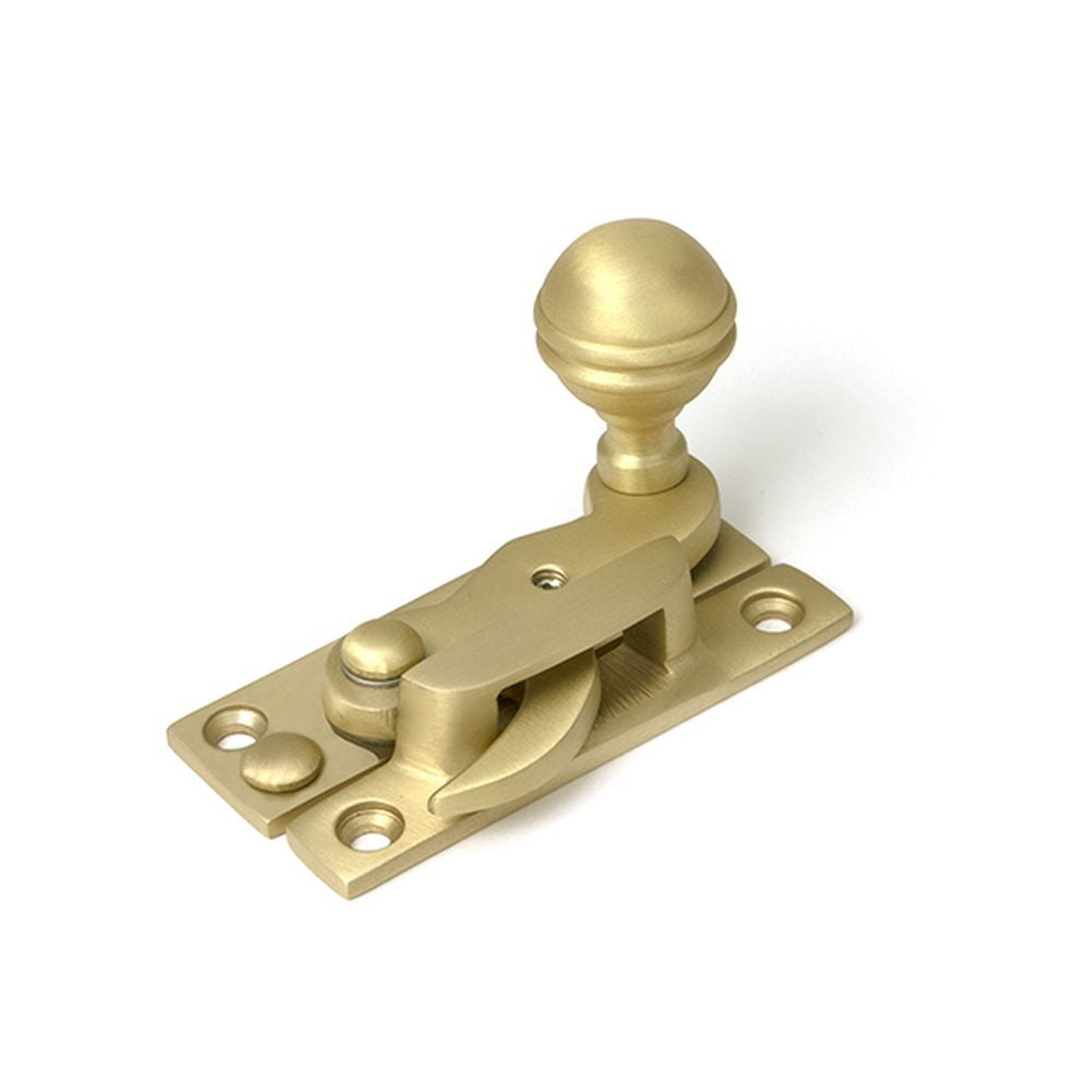 High quality images of the From The Anvil - Satin Brass Prestbury Sash Hook Fastener | Sku. Anvil-52368 | available to order from Trade Door Handles, quick delivery at discounted prices.
