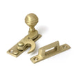 High quality images of the From The Anvil - Satin Brass Prestbury Sash Hook Fastener | Sku. Anvil-52368 | available to order from Trade Door Handles, quick delivery at discounted prices.