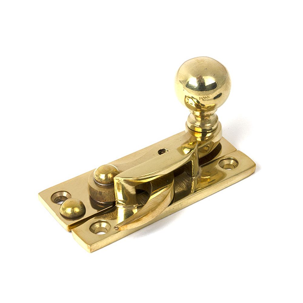 High quality images of the From The Anvil - Polished Brass Sash Hook Fastener | Sku. Anvil-52369 | available to order from Trade Door Handles, quick delivery at discounted prices.
