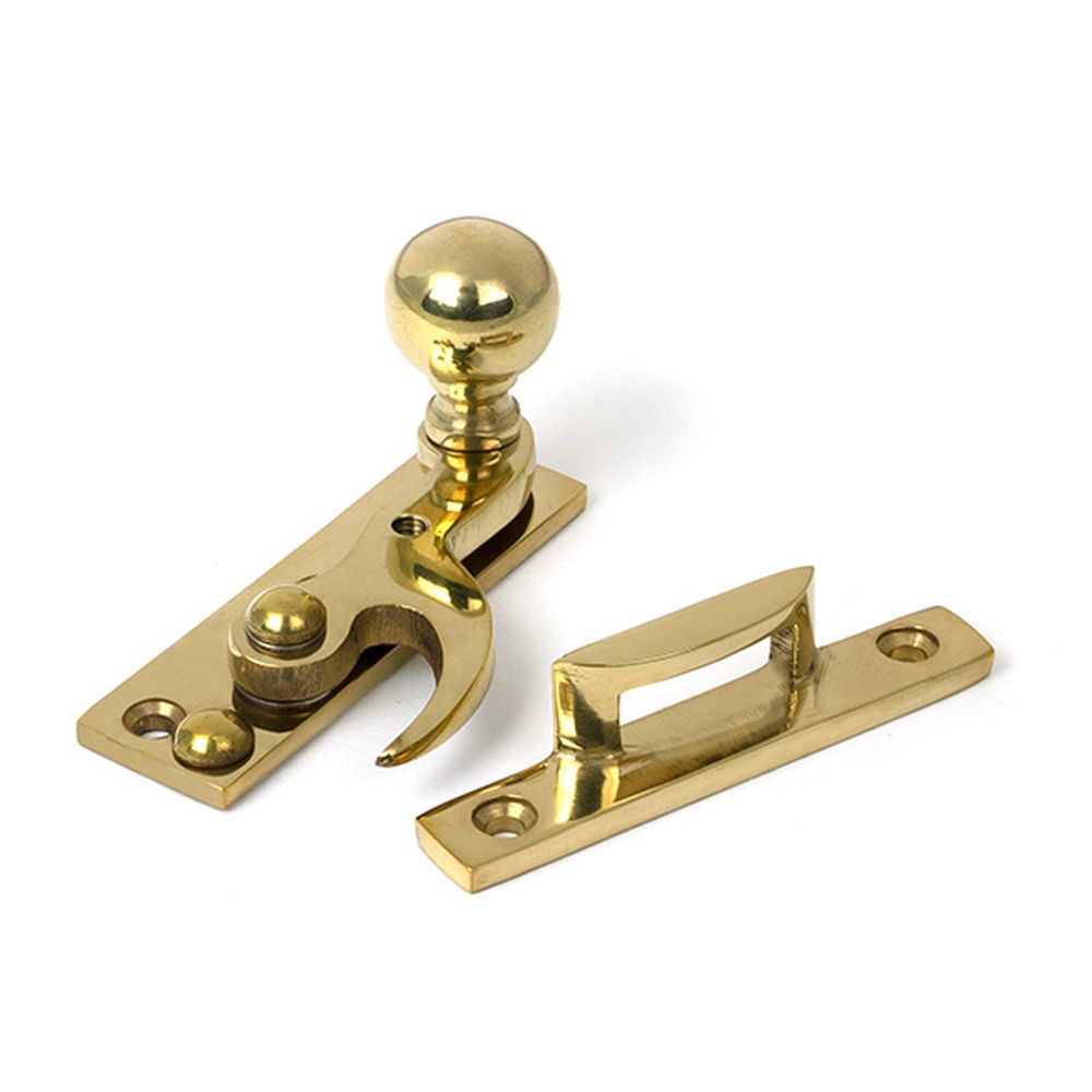 High quality images of the From The Anvil - Polished Brass Sash Hook Fastener | Sku. Anvil-52369 | available to order from Trade Door Handles, quick delivery at discounted prices.