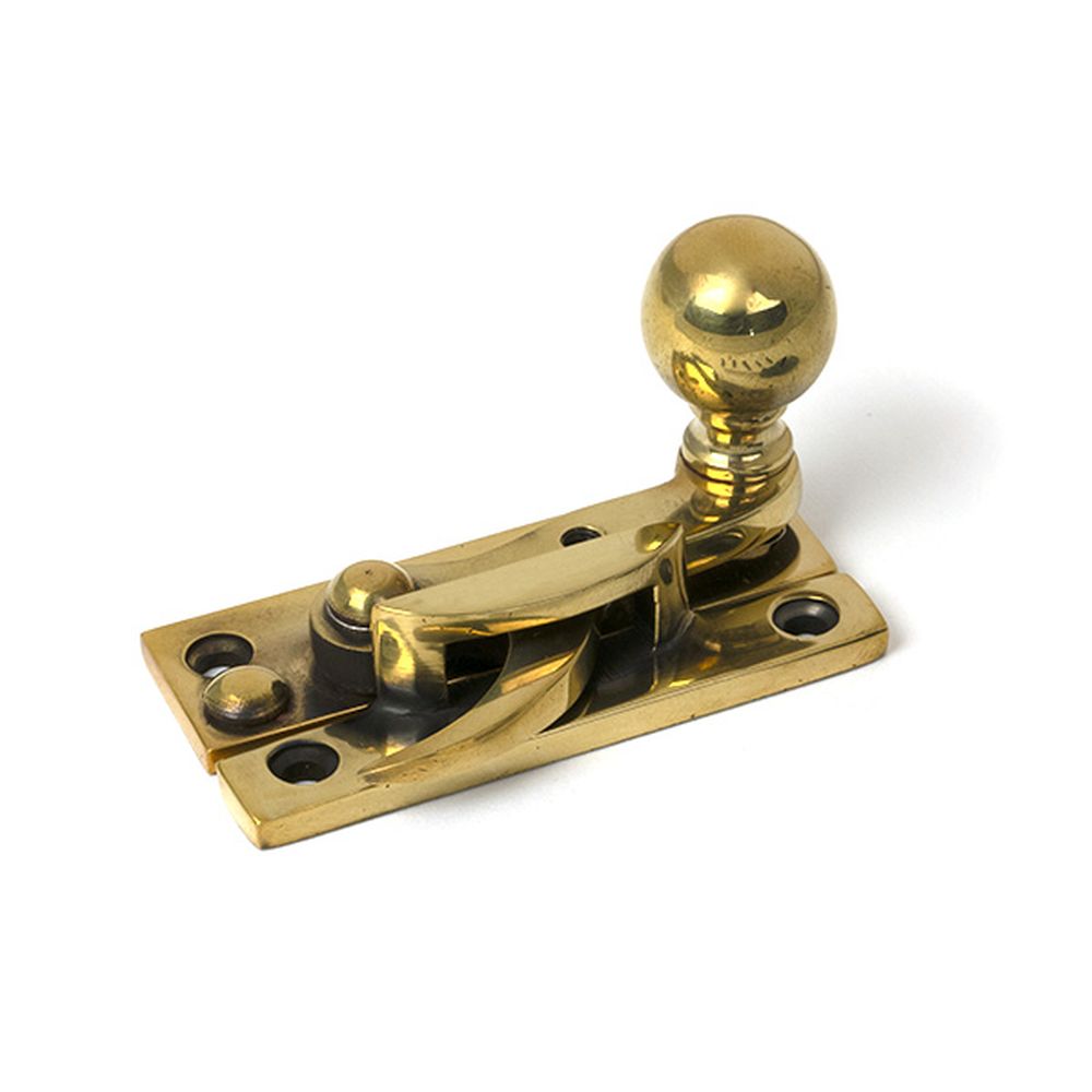 High quality images of the From The Anvil - Aged Brass Sash Hook Fastener | Sku. Anvil-52370 | available to order from Trade Door Handles, quick delivery at discounted prices.
