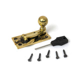 High quality images of the From The Anvil - Aged Brass Sash Hook Fastener | Sku. Anvil-52370 | available to order from Trade Door Handles, quick delivery at discounted prices.