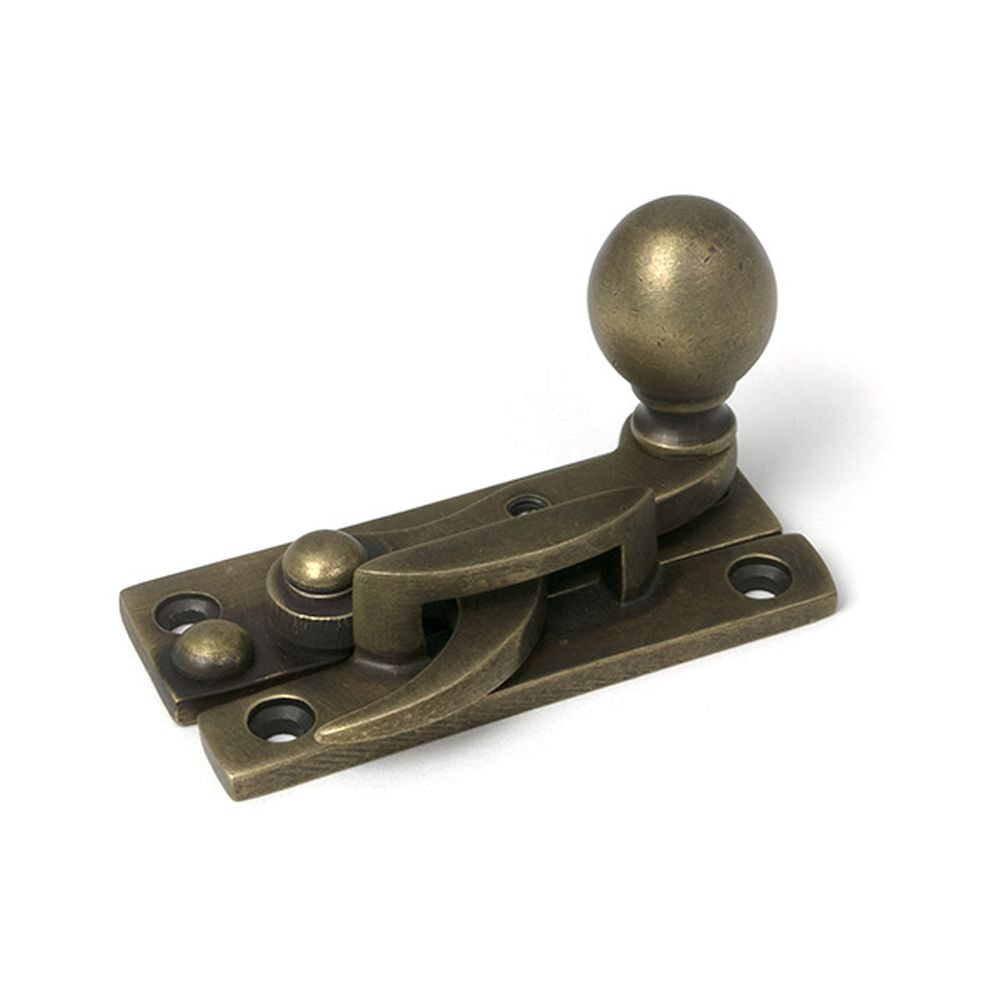 High quality images of the From The Anvil - Burnished Brass Sash Hook Fastener | Sku. Anvil-52376 | available to order from Trade Door Handles, quick delivery at discounted prices.