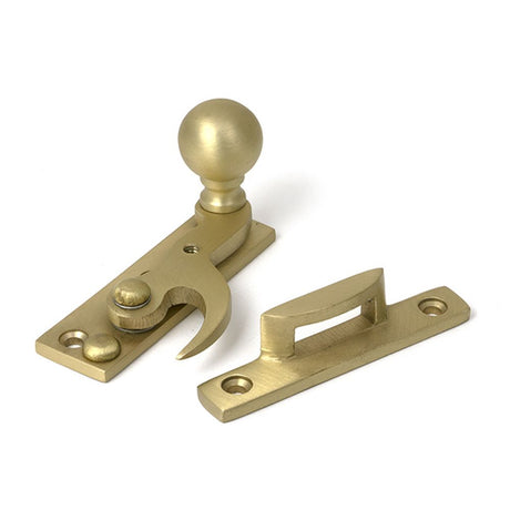 High quality images of the From The Anvil - Satin Brass Sash Hook Fastener | Sku. Anvil-52377 | available to order from Trade Door Handles, quick delivery at discounted prices.