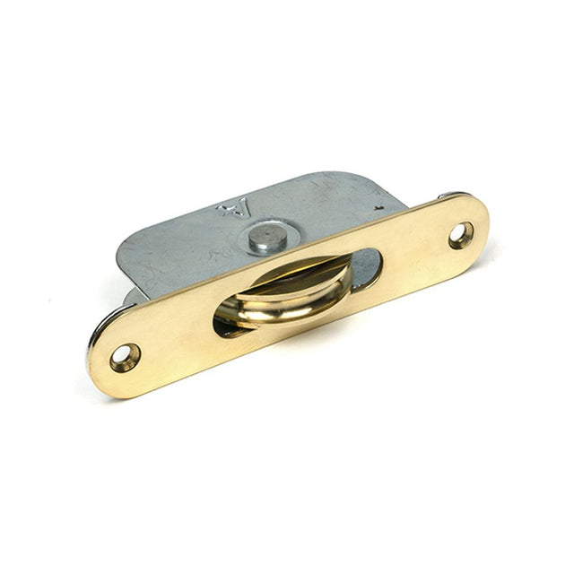High quality images of the From The Anvil - Polished Brass Radiused Sash Pulley 75kg | Sku. Anvil-52389 | available to order from Trade Door Handles, quick delivery at discounted prices.