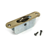High quality images of the From The Anvil - Aged Brass Radiused Sash Pulley 75kg | Sku. Anvil-52395 | available to order from Trade Door Handles, quick delivery at discounted prices.