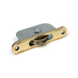 High quality images of the From The Anvil - Aged Brass Radiused Sash Pulley 75kg | Sku. Anvil-52395 | available to order from Trade Door Handles, quick delivery at discounted prices.