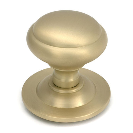 High quality images of the From The Anvil - Satin Brass Round Centre Door Knob | Sku. Anvil-52405 | available to order from Trade Door Handles, quick delivery at discounted prices.