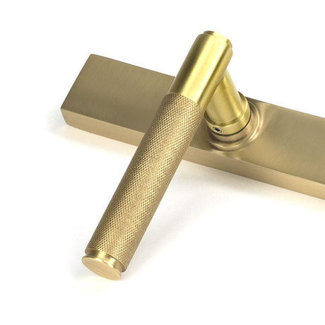 High quality images of the From The Anvil - Satin Brass Brompton Slimline Lever Espag. Latch Set | Sku. Anvil-52419 | available to order from Trade Door Handles, quick delivery at discounted prices.