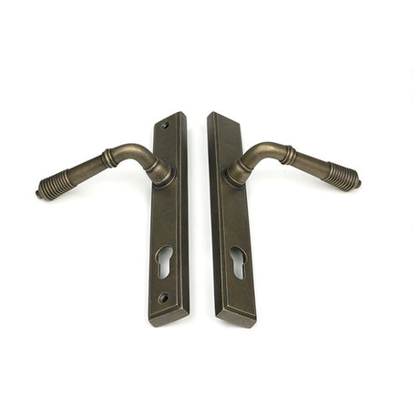 High quality images of the From The Anvil - Burnished Brass Reeded Slimline Lever Espag. Lock Set | Sku. Anvil-52423 | available to order from Trade Door Handles, quick delivery at discounted prices.