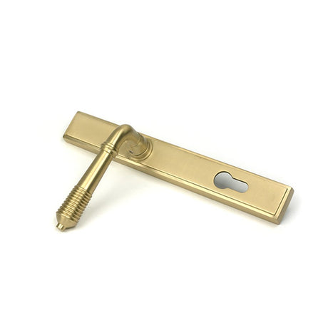 High quality images of the From The Anvil - Satin Brass Reeded Slimline Lever Espag. Lock Set | Sku. Anvil-52424 | available to order from Trade Door Handles, quick delivery at discounted prices.