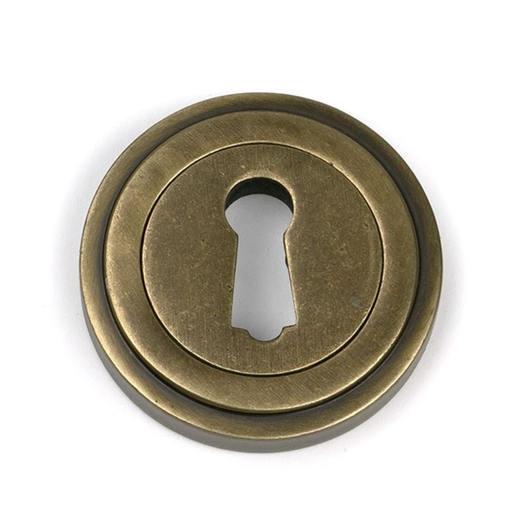 High quality images of the From The Anvil - Burnished Brass Round Escutcheon (Art Deco) | Sku. Anvil-52444 | available to order from Trade Door Handles, quick delivery at discounted prices.