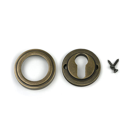 High quality images of the From The Anvil - Burnished Brass Round Euro Escutcheon (Art Deco) | Sku. Anvil-52448 | available to order from Trade Door Handles, quick delivery at discounted prices.