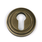 High quality images of the From The Anvil - Burnished Brass Round Euro Escutcheon (Art Deco) | Sku. Anvil-52448 | available to order from Trade Door Handles, quick delivery at discounted prices.
