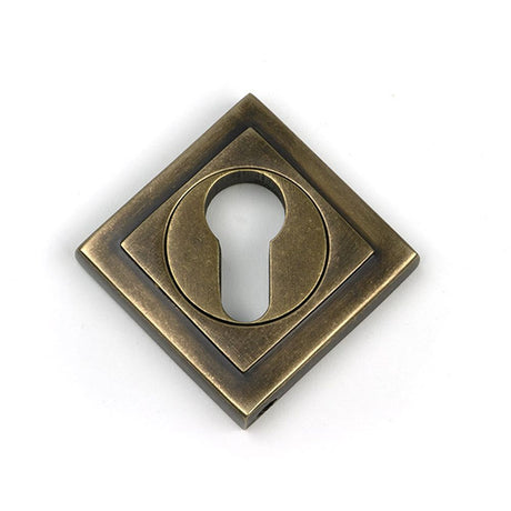 High quality images of the From The Anvil - Burnished Brass Round Euro Escutcheon (Square) | Sku. Anvil-52450 | available to order from Trade Door Handles, quick delivery at discounted prices.