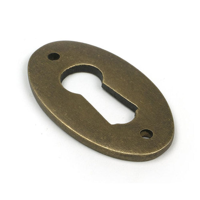 High quality images of the From The Anvil - Burnished Brass Oval Escutcheon | Sku. Anvil-52455 | available to order from Trade Door Handles, quick delivery at discounted prices.