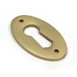 High quality images of the From The Anvil - Satin Brass Oval Escutcheon | Sku. Anvil-52456 | available to order from Trade Door Handles, quick delivery at discounted prices.