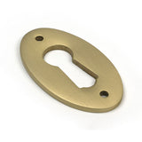High quality images of the From The Anvil - Satin Brass Oval Escutcheon | Sku. Anvil-52456 | available to order from Trade Door Handles, quick delivery at discounted prices.