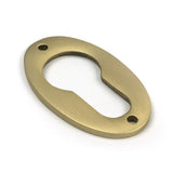 High quality images of the From The Anvil - Satin Brass Oval Euro Escutcheon | Sku. Anvil-52458 | available to order from Trade Door Handles, quick delivery at discounted prices.