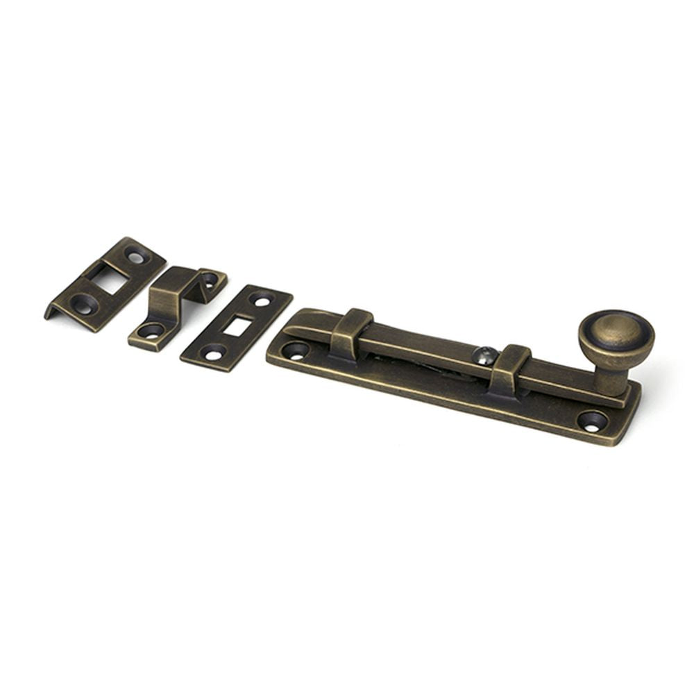 High quality images of the From The Anvil - Burnished Brass 4" Universal Bolt | Sku. Anvil-52459 | available to order from Trade Door Handles, quick delivery at discounted prices.